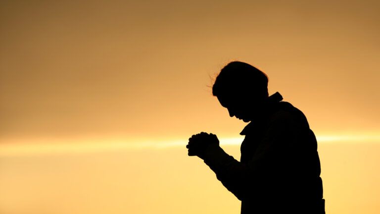 Woman praying for forgiveness