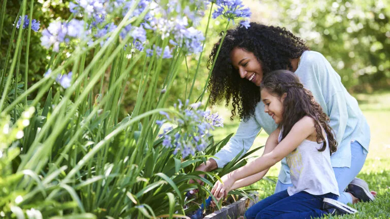 Mother and daughter looking at flowers