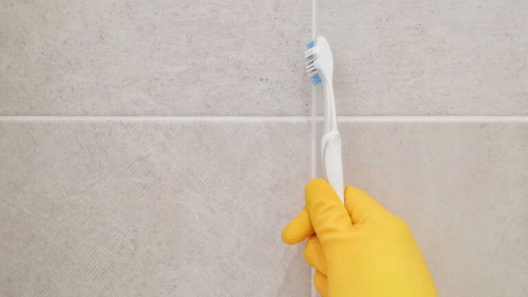 Use an old toothbrush to scrub grout.