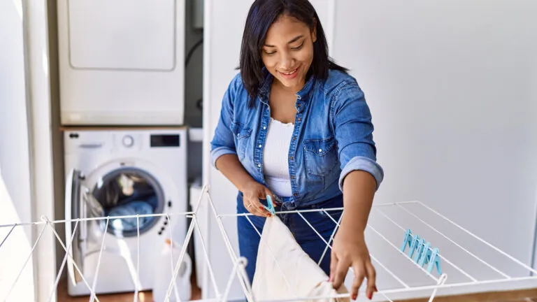 Woman hanging clothes to dry