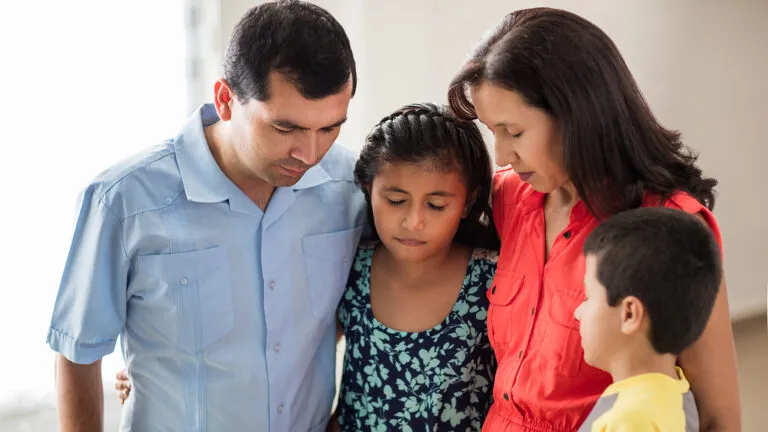 A family prayers together for their lent family activities