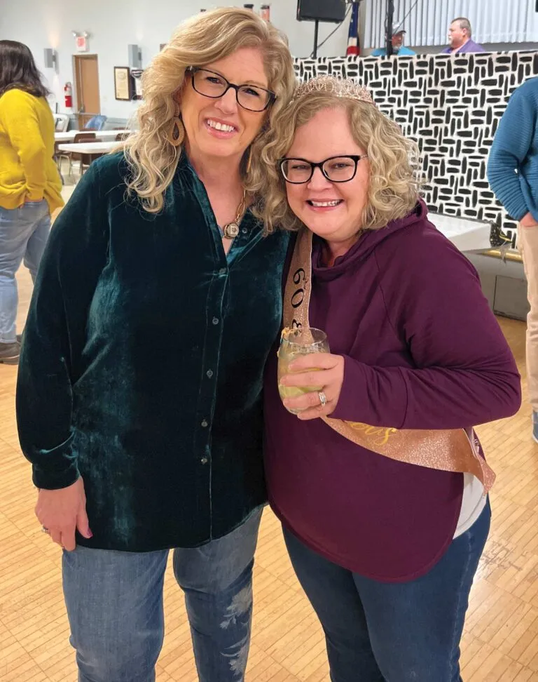 Pam Walker, left, at her sister Lisa's (right) Surprise 60th birthday party