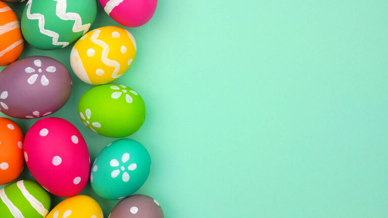 Colorful easter eggs on a blue background for an Easter tradition