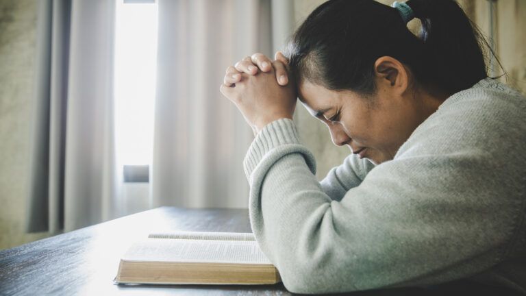 Woman at prayer. Find powerful ways to end your prayers