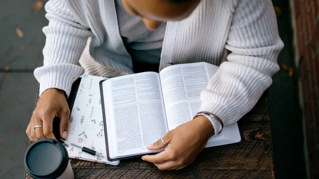 A woman reads the Bible in the morning