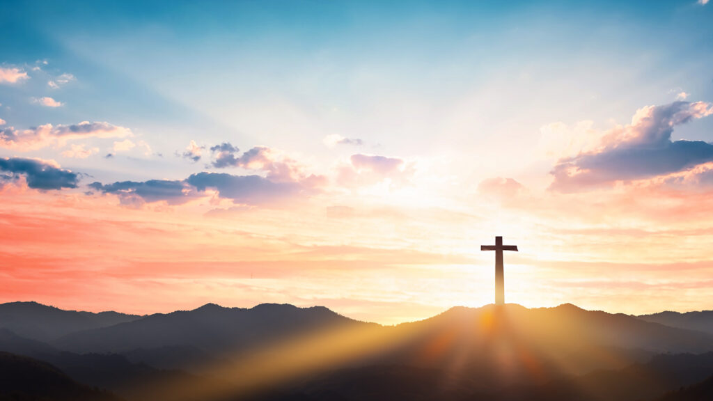 Cross on a mountain representing the message of Easter