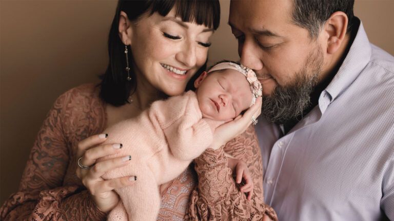 Amanda McCollough with daughter Rosie,” Isabel Poppy-Rose Saucedo, and husband. Credit: Erin Ripley Photography, LLC