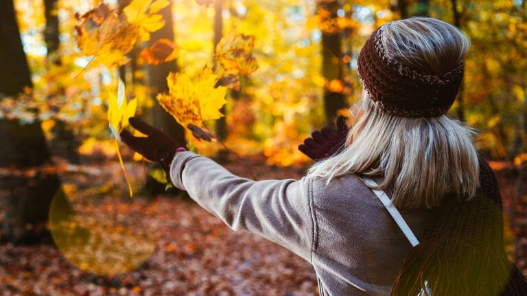 Royalty-free image: A woman savors the fall foliage; Getty Images